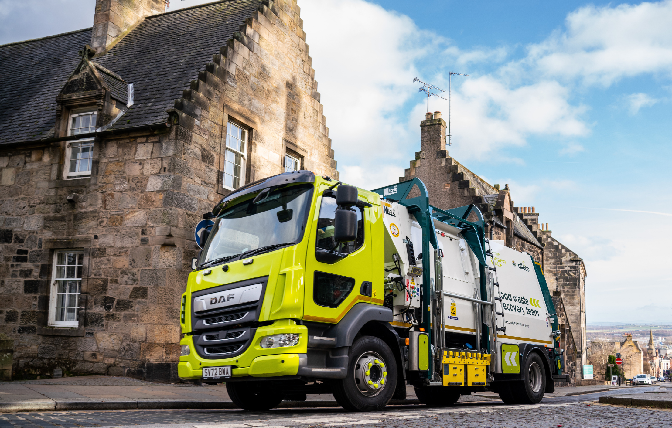 Olleco food waste collection vehicle outside a restaurant