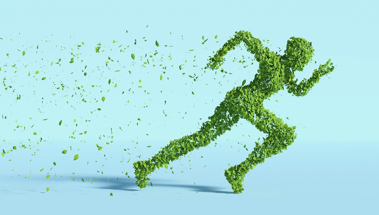 Running figure made of leaves against blue background